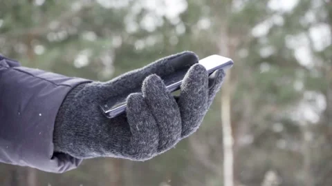 Using smartphone in winter with gloves for touch screens Stock Footage 201146772