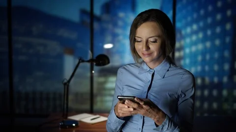 Using Smartpone in the office, Smiling, Texting, New Technology, Business Stock Footage 95412296