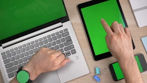 Using a Smartwatch Laptop Tablet Smartphone With Green Screen Stock Footage 100524813
