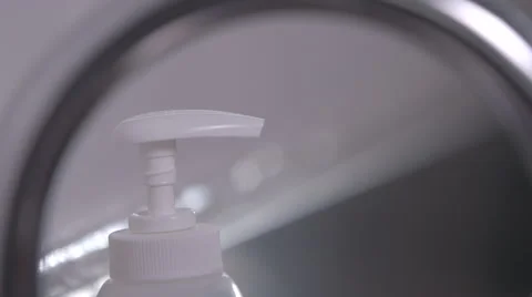 Using a soap dispenser Stock Footage 64055906