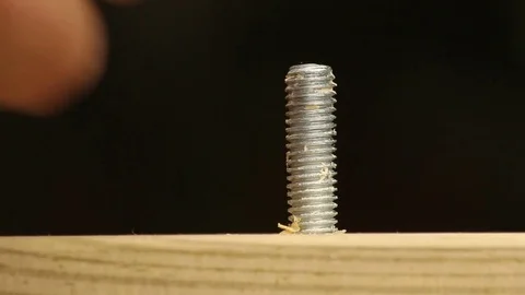 Using a spanner to tighten a nut and bolt Stock Footage 72558453