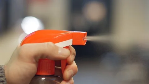 Using spray bottle Stock Footage 122243187