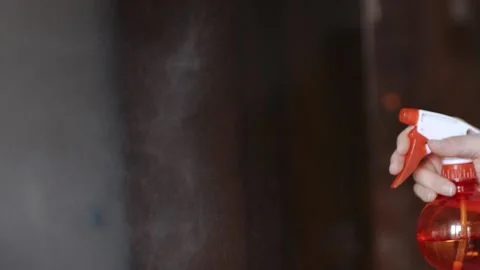 Using a spray gun for cleaning, shooting in slow motion. Stock Footage 186791584