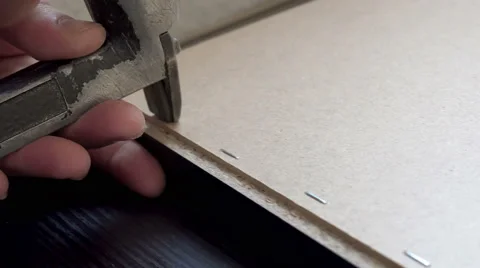 Using staple gun to fix back side of the closet in furniture factory, sound i Stock Footage 62907518