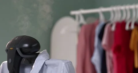 Using steam system for ironing clothes3 Stock Footage 131843831