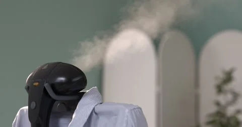 Using steam system for ironing clothes5 Stock Footage 131845315
