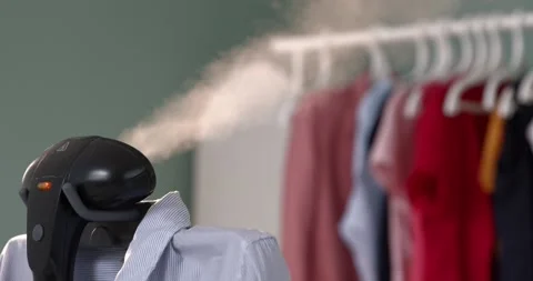 Using steam system for ironing clothes8 Stock Footage 131845766