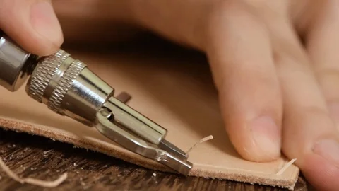 Using a stitching groover on vegetable tanned leather Stock Footage 126074199