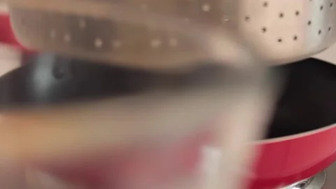 	using a strainer to make scrambled eggs Stock Footage 133814927
