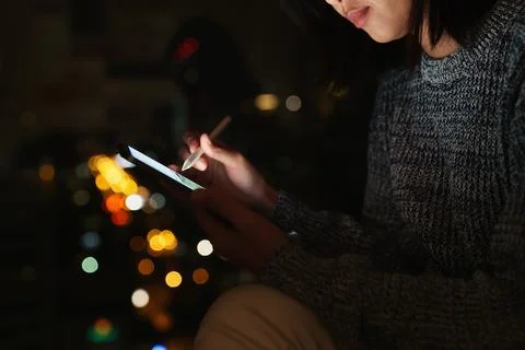 Using stylus pen on digital tablet at night, lifestyle at night Stock Photos