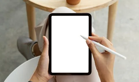 Using stylus pen on digital tablet first person view Stock Photos