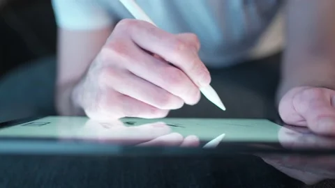 Using a Stylus Pen on a Digital Touch Screen Tablet Closeup Stock Footage 180206533