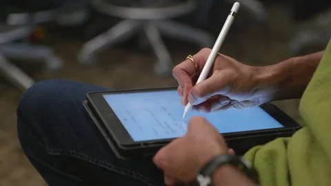Using a Stylus to Write on a Tablet Stock Footage 147360164