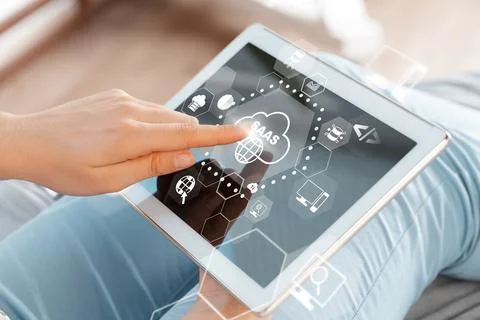 Using a tablet to access SaaS applications for work or personal tasks Stock Photos