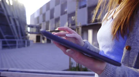 Using tablet in bright futuristic business complex 4K Vidéo 49839318