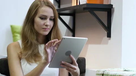Using Tablet for Browsing Online, Young Girl Video stock 67475533