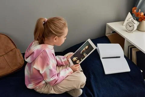Using tablet for communication with tutor 스톡 사진