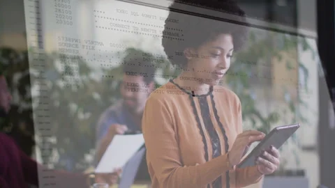 Using tablet with computer code overlay, woman in modern office animation Stock Footage 304861354