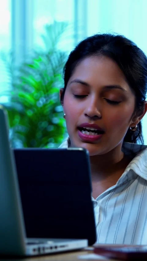 Using tablet computer at work, Indian businesswoman focuses on office task Video stock 342572847