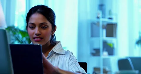 Using tablet computer at work, Indian businesswoman focuses on office task Video stock 342573831
