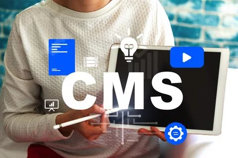 Using a tablet to explore content management system features and tools in a Stock Photos