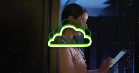 Using tablet female tech in button-up shirt with lanyard at server room, neon Stock Photos
