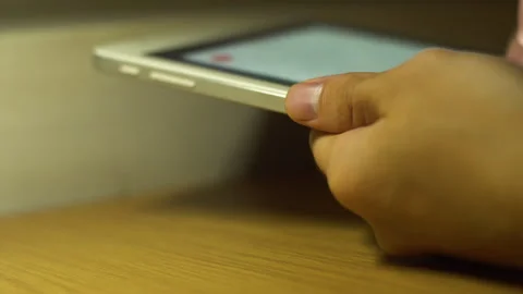 Using tablet Stock Footage 254498379