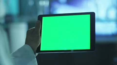 Using Tablet with Green Screen in Landscape Mode. Scientific Environment. Stock Footage 48638507