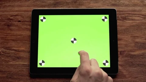 Using Tablet with Green Screen on Wooden Table. Great For Mock-up Usage Stock Footage 74393493