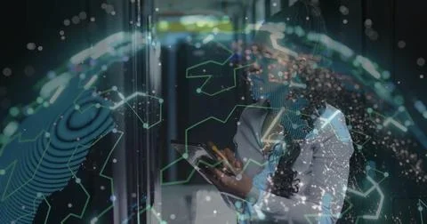 Using tablet IT professional navigating server rack corridor with holographic Stock Photos