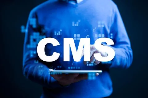 Using a tablet to manage content in a digital environment with CMS technology Stock Photos