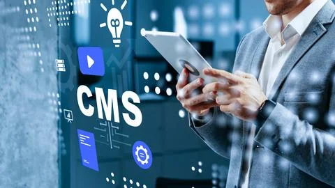 Using a tablet to manage content within a CMS system in an office setting Stock Photos