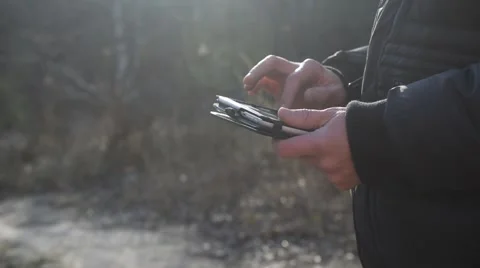 Using tablet in nature Stock Footage 66586830