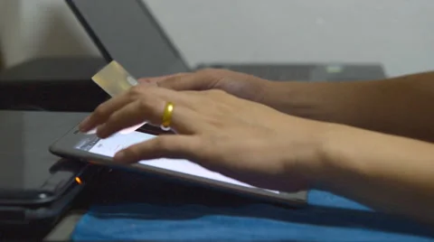Using tablet for payment online by credit card Stock Footage 40512837