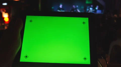 Using Tablet PC  with a green screen  in  night club . Stock Footage 49311047