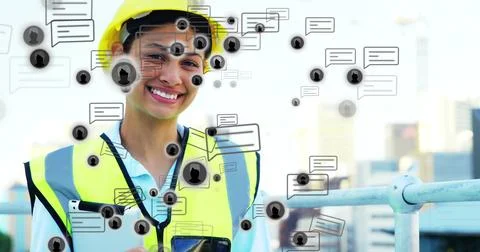 Using tablet, phone, engineer in yellow hardhat  and  hivis-vest with chat Stock Photos