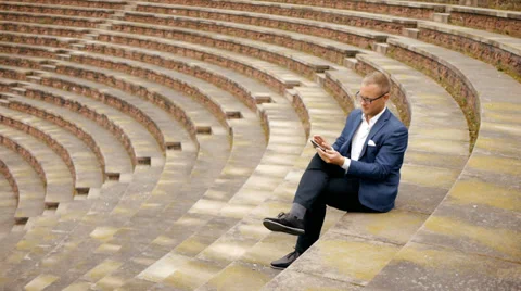 Using tablet phone. searching the web. businessman. handsome male. person. Stock Footage 38099406