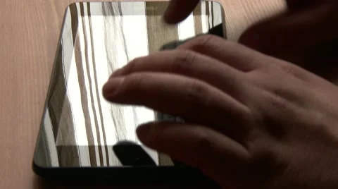 Using Tablet on Table 5 Stock Footage 40345303