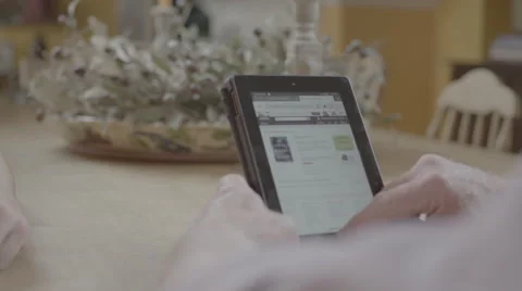 Using a tablet at a table Stock Footage 61271189