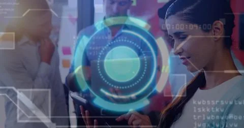 Using tablet UX designer wearing white blouse showing holographic interface in Stock Photos