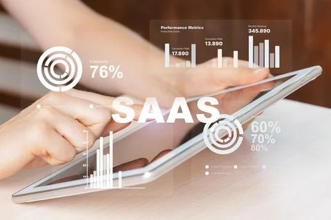 Using a tablet to view performance metrics for Saas application in an office Stock Photos