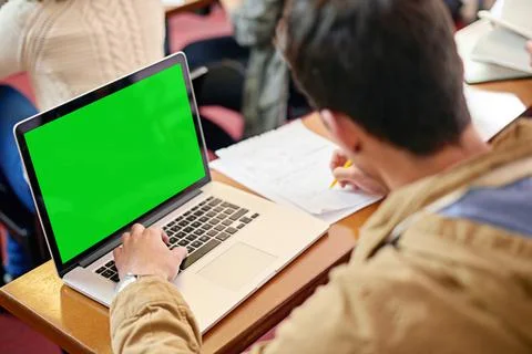 Using tech to further his education. Overhead shot of a student using his lap Stock Photos