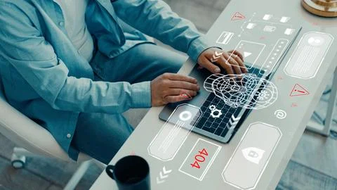 Using technology to create a deep fake while sitting at a desk in a modern Foto stock