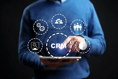 Using technology for CRM tasks with a digital tablet in a dark setting Stock Photos