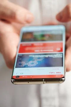 Using TED talks mobile app Stock Photos