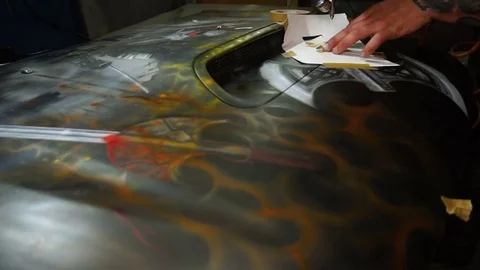 Using a template to paint the car in the workshop Stock Footage 80932040
