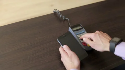 Using the Terminal and the Phone Man is Paying the Price Stock Footage 68938562