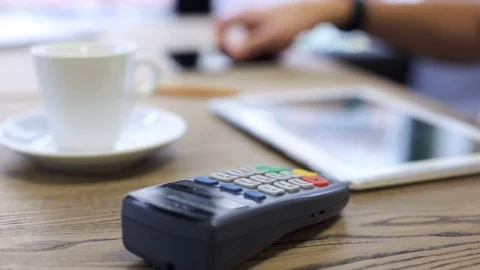 Using the terminal and the phone man is paying the price Stock Footage 80372224