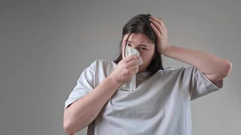 Using a tissue to clean the nose, with nasal moisturizing and cleansing products Stock Footage 285623868