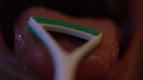 Using tongue scraper closeup Stock Footage 82826795